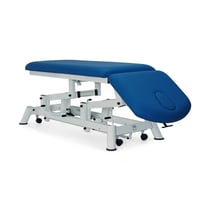 Hydraulic examination stretcher: two bodies, with negative reclining backrest, toilet roll holder, facial cap and retractable wheels