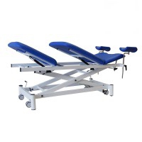 Three-section electric gynecological table, ideal for medical specialties, Kinefis Explore: with welded steel profile structure, retractable wheels, adjustable backrest, leg loops and facial hole