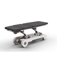 High-end electric stretcher Naggura N'Run5S EVO: three bodies, two motors, short headboard, side button to accommodate Trendelenburg and lumbar flexion positions, and heating