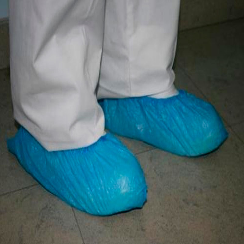 Green colored plastic shoe covers 100 units Shoe covers Disposable